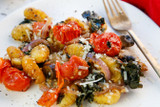 Crispy Sheet Pan Gnocchi with Tomatoes, Mushrooms, and Kale