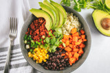 Brown Rice Bowls with Soy Chorizo, Roasted Sweet Potatoes, Black Beans, Corn, Green Onion, and Avocado