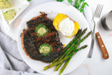 Brown Sugar, Chili-Rubbed Ribeye Steaks with Herb Butter