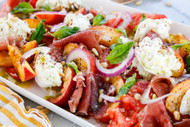 Peach and Tomato Caprese Salad with Pine Nuts, Prosciutto, and Tarragon Oil