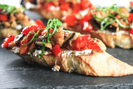 Bruschetta with Eggplant, Red Pepper, Tomatoes, and Goat Cheese