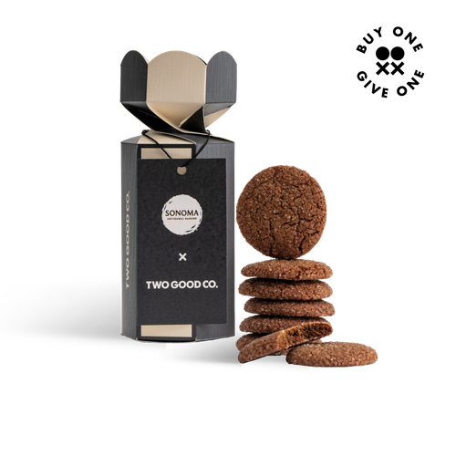 Two Good Co x Sonoma gingersnap biscuits in packaging, stacked beside the box