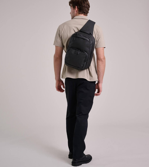 Black Crest Sling Bag Crossbody One Strap Backpack for Laptop and Commuters Front