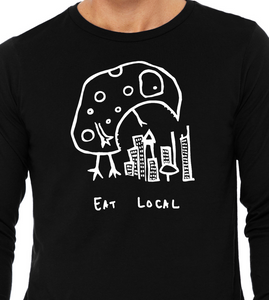Close-up of Eat Local kaiju monster illustration over city buildings on graphic tee long sleeve