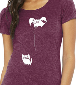 Close up of surreal cat t shirt winged cat lowering string to another cat minimalist design.