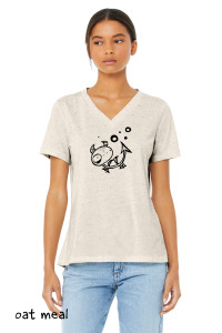 Model wearing simple magical creature t shirt oat meal.
