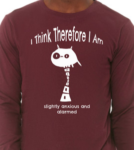 Close up of man wearing philosophical monster illustration inspired by Descartes with humorous existential quote on maroon tee.