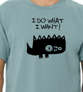 Close-up of spiky cartoon monster illustration with bold “I Do What I Want!” text on blue tee.