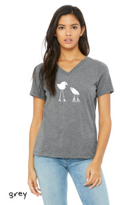 Woman wearing minimalist two birds grey t shirt parent and baby bird simple graphic design.
