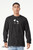 Model wearing charcoal parent and baby bird graphic tee symbolic design.