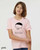 Model wearing pink funny philosophy graphic t-shirt that says “bad case of the human condition.”
