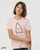 Pink Only Good Vibes monster youth t-shirt with minimalist triangle creature illustration.