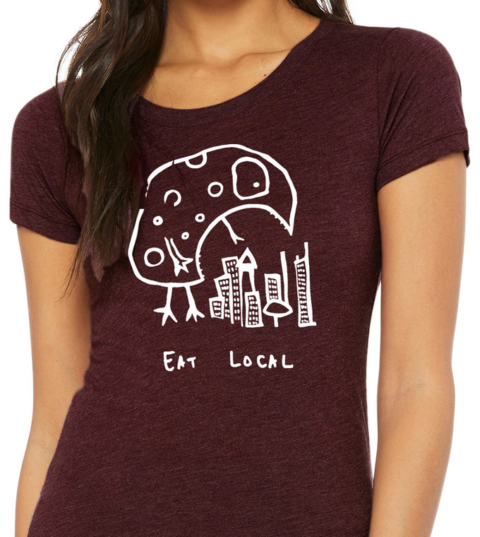 Close-up of Eat Local city-eating monster graphic on women’s tri blend scoop neck tee