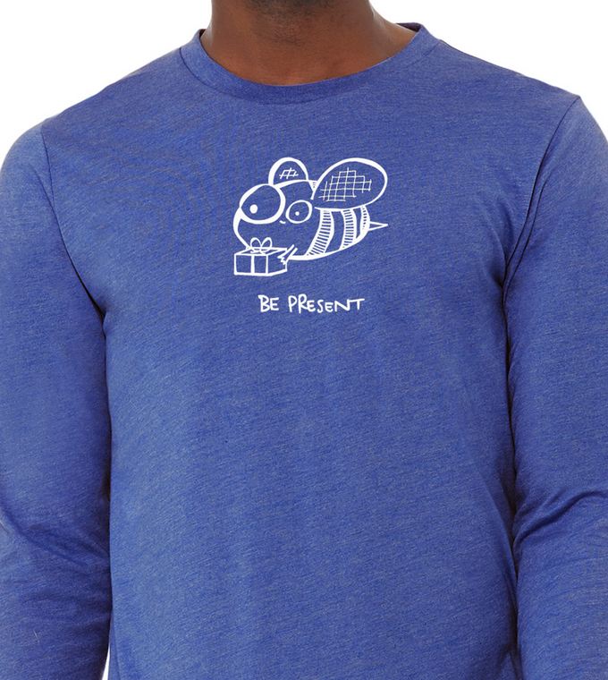 Close up of be present bee t shirt cute bee holding gift mindfulness pun graphic tee.