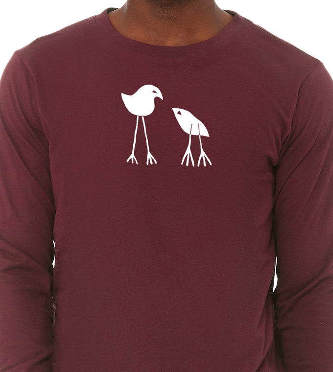 Close up of man wearing parent and baby bird graphic tee symbolic design.