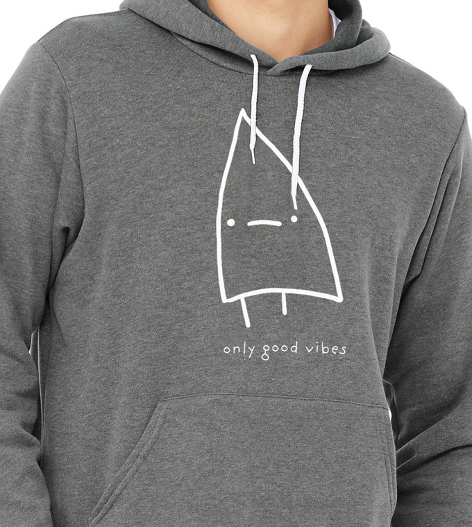 Close-up of minimalist triangle monster design with the phrase Only Good Vibes.