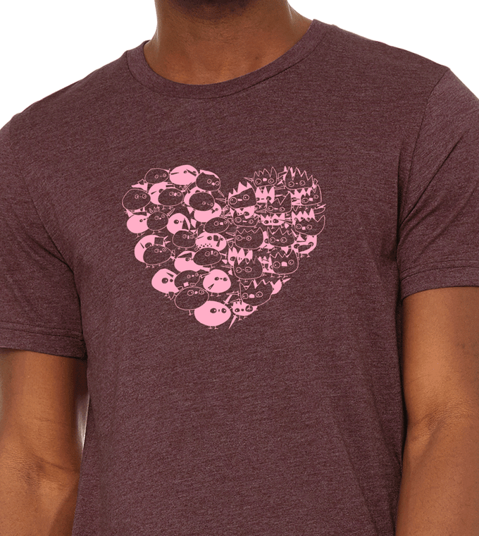 Close up of heart shaped design made of battling monster characters. Bella Canvas unisex tee heather maroon.