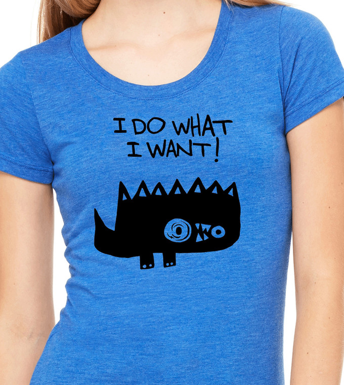 Close-up of spiky cartoon monster illustration with humorous polite rebellion quote on blue women's fitted tee.