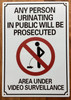 ANY PERSON URINATING IN PUBLIC WILL BE PROSECUTED -NO PUBLIC URINATION SIGN