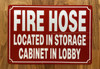 FIRE HOSE LOCATED IN STORAGE CABINET IN LOBBY SIGN