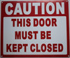 SIGNS CAUTION THIS DOOR MUST
