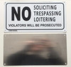 NO SOLICITING TRESPASSING LOITERING VIOLATORS WILL BE PROSECUTED SIGN