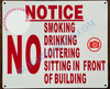 NOTICE NO SMOKING DRINKING LOITERING SITTING IN FRONT OF BUILDING SIGN