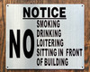 NO SMOKING DRINKING LOITERING SITTING IN FRONT OF BUILDING SIGN