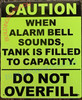 CAUTION: WHEN ALARM BELL SOUNDS, TANK IS FILLED TO CAPACITY Signage