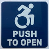 Sign Push to open with symbol of wheelchair  - ada