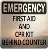 Sign FIRST AID AND CPR KIT BEHIND COUNTER