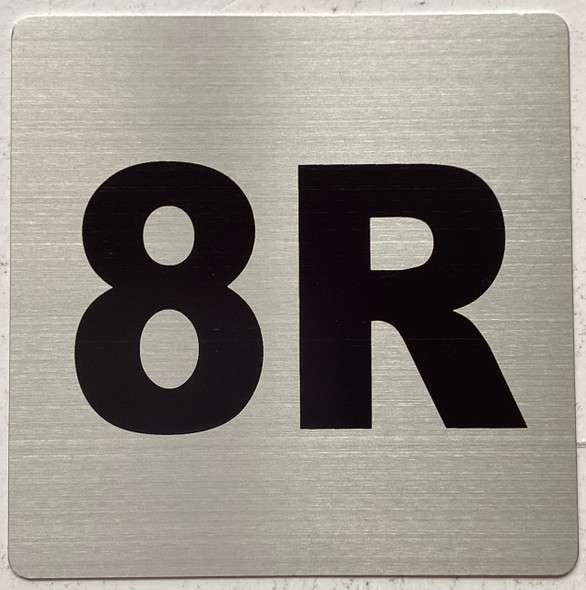 Apartment number 8R sign