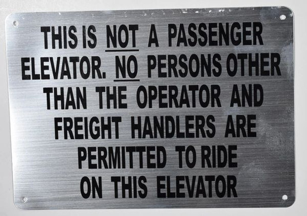 Fire Department Sign-THIS IS NOT A PASSENGER ELEVATOR. NO PERSONS OTHER THAN THE OPERATOR AND FREIGHT HANDLERS ARE PERMITTED TO RIDE ON THIS ELEVATOR