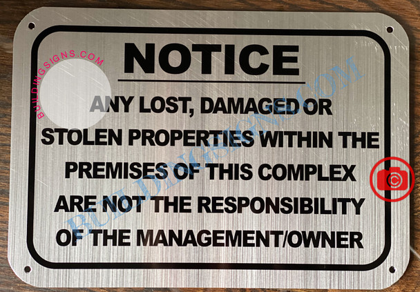 NOTICE ANY LOST DAMAGED OR STOLEN PROPERTIES WITHIN THE PREMISES OF THIS COMPLEX ARE NOT THE RESPONSIBILITY OF THE MANAGEMENT OR OWNER SIGN