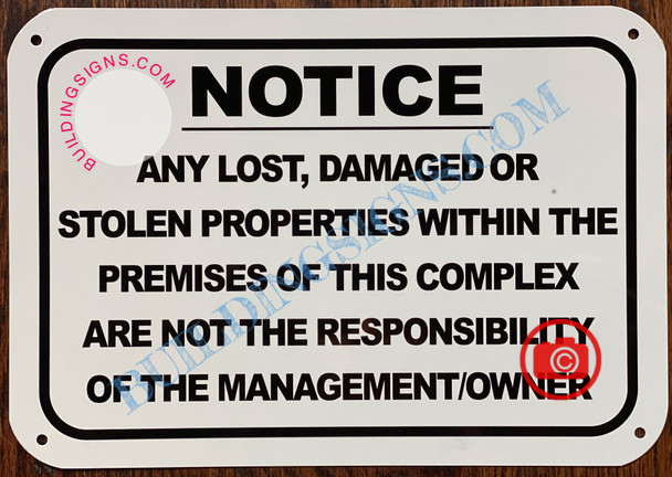 NOTICE ANY LOST DAMAGED OR STOLEN PROPERTIES WITHIN THE PREMISES OF THIS COMPLEX ARE NOT THE RESPONSIBILITY OF THE MANAGEMENT OR OWNER SIGN