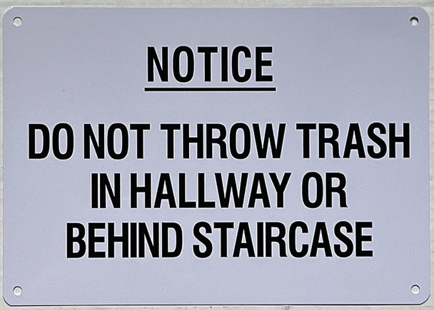 NOTICE: DO NOT THROW TRASH IN HALLWAY OR BEHIND STAIRCASE SIGN