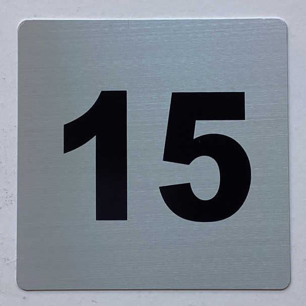 Apartment number 15 sign