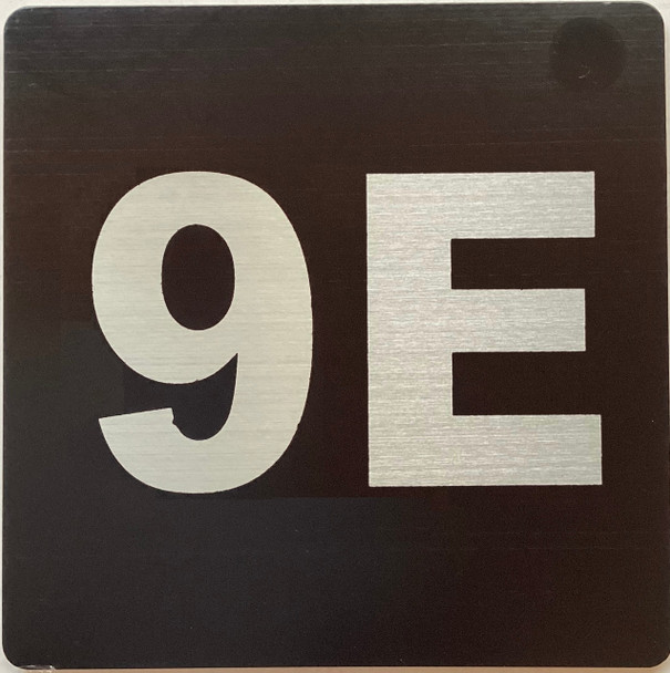 Apartment number 9E sign