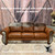 smooth-tan-leather-couch-with-cowhide-yoke-country-western-style