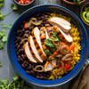Chicken fajita bowl dinner with grilled chicken, yellow rice and beans, corn, onions, and bell peppers.
