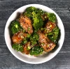 Beef and broccoli bowl with flank steak, broccoli, brown sauce, and rice.