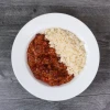 Prepared beef chili dinner with traditional chili spices and white rice.