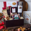 Thanksgiving Gift Basket Classic overflowing with gourmet chocolates, artisan cookies, cocoa-dusted almonds, and holiday treats in an autumn arrangement