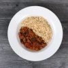 Top-down view of turkey chili with herb brown rice