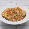Classic chicken pot pie with flaky puff pastry crust and creamy chicken and vegetable filling