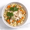 Top-down view of classic chicken noodle soup in a white bowl
