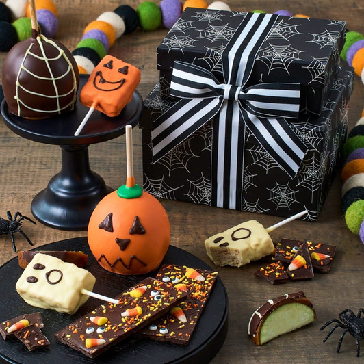 Wickedly Good Halloween gift set featuring Belgian dark and orange chocolate caramel apples, white chocolate dipped crispy pops, and candy corn milk chocolate bark