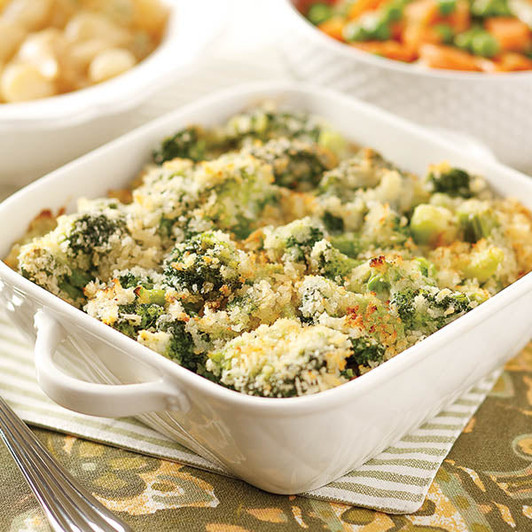 Broccoli Parmesan Gratin with a golden breadcrumb topping in a white casserole dish.
