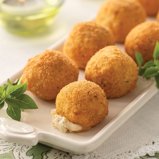 Golden Burrata Cheese Bites on a white platter, with one opened to show the creamy filling.