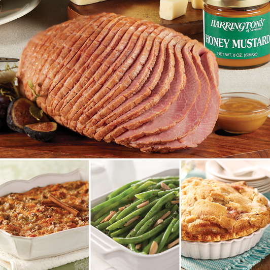 Boneless Ham Feast with sliced ham, sweet potato casserole, green bean almondine and apple pie; honey mustard and cheese props are not included.